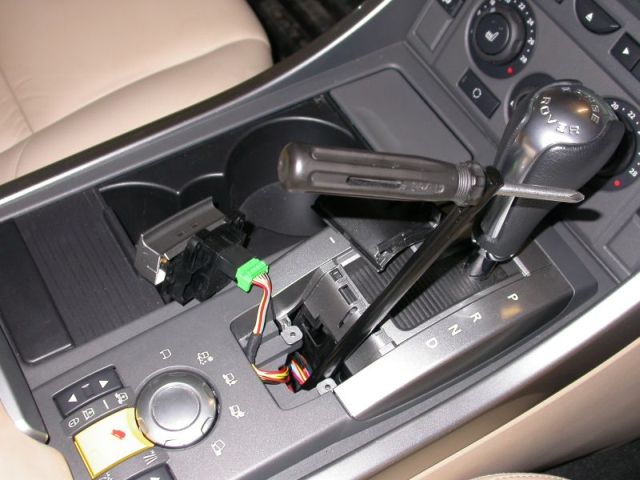 The land rover has a lever for the parking brake, another to shift